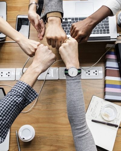 Colleagues giving a fist bump